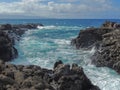 Coastline and rugged lava rocks called DragonÃ¢â¬â¢s Teeth and crashing waves at Makaluapuna Point near Kapalua, Maui, HI, USA